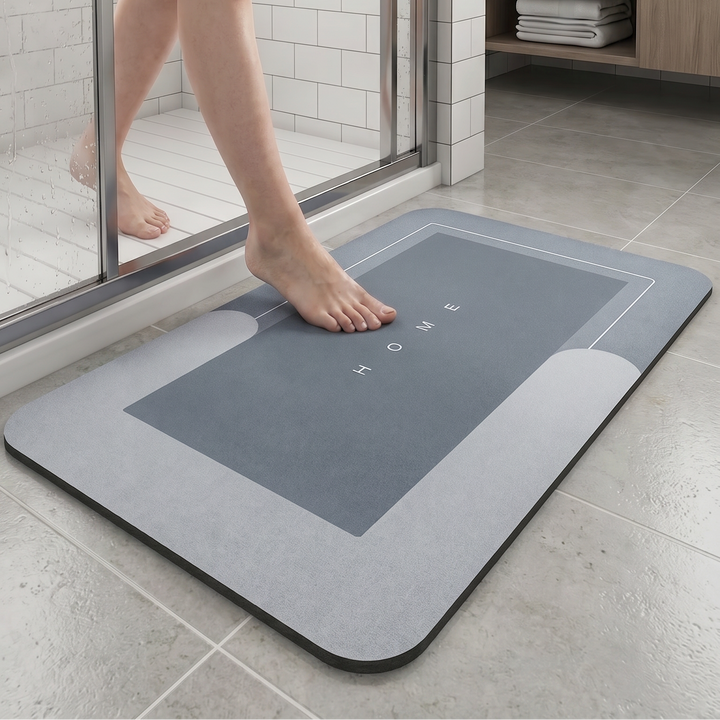 Person stepping onto a bath mat in a bathroom
